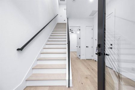 This home has white oak flooring throughout, which adds a warm and inviting feel to the space.