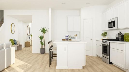 Kitchen with white cabinetry, light wood-type flooring, gas stove, and backsplash