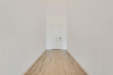 Hallway with light wood-type flooring