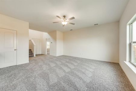 Living room with light carpet and ceiling fan