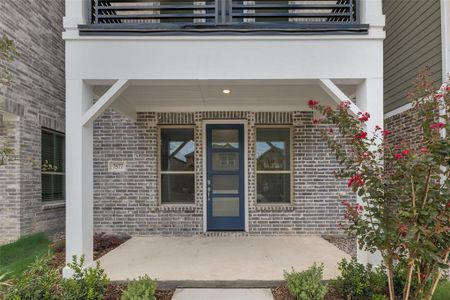 Doorway to property with a balcony