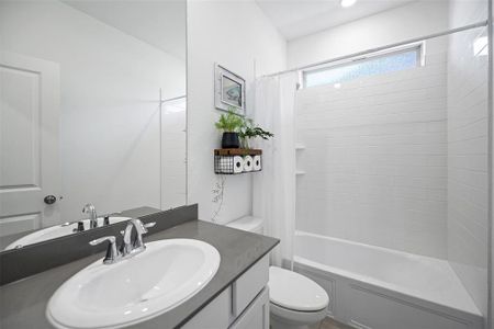 Secondary Bath downstairs located between the Study and Guest Bedroom.