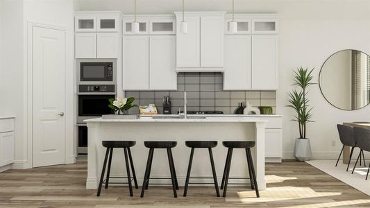 Kitchen with an island with sink, light hardwood / wood-style floors, black microwave, oven, and decorative backsplash