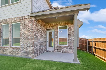 Entrance to property with a lawn