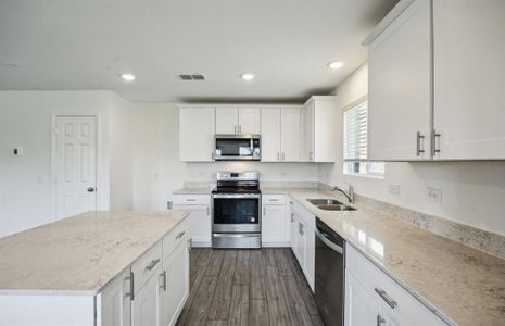 Spacious kitchen with ample cabinet space *real home pictured