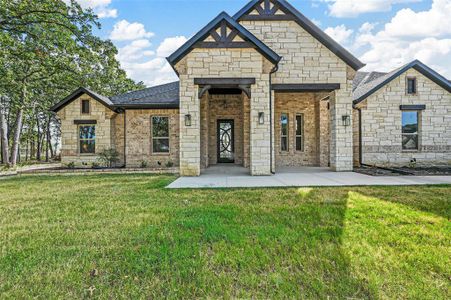 French country style house with a front yard