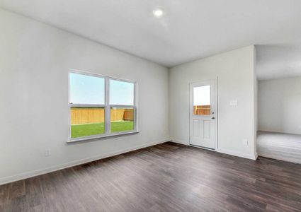 Rio dining nook with hardwood floors, white framed windows, and recessed light