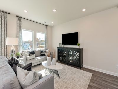 The family room provides a gathering place for everyone and is open to kitchen and dining area.