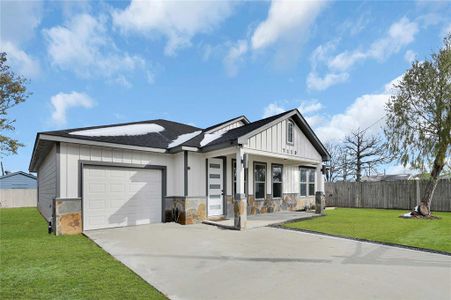 1 car attached garage and double wide driveway.