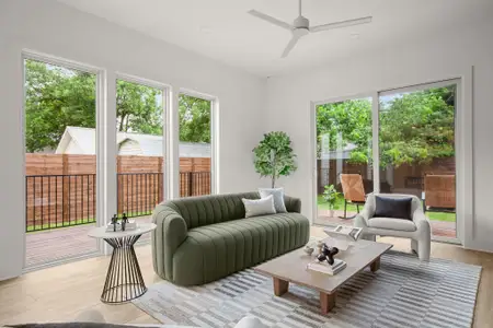 Living area with light wood-style floors, recessed lighting, and ceiling fan