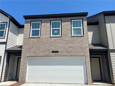 New construction Townhouse house 714 Rhone Street, Cumming, GA 30041 Foxglove Homeplan- photo 0