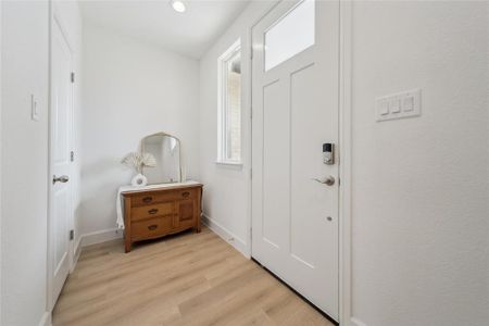 Doorway to outside featuring light hardwood / wood-style flooring