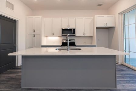 Luxury Kitchen features White Soft Close Cabinets with under cabinet lighting *Home is Under Construction. Photos shown are from other TPG Communities to display how the home will live*