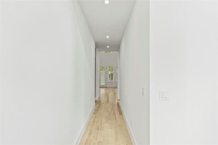 Hallway with light wood-type flooring