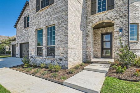 Doorway to property with a garage