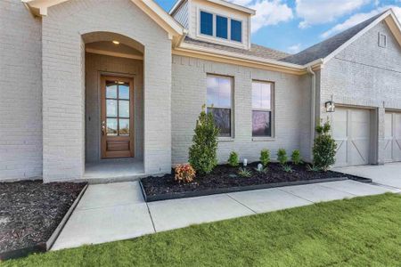 Doorway to property featuring a garage