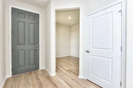 Foyer entrance featuring baseboards and light wood-style flooring