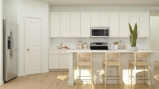 Kitchen with a kitchen breakfast bar, decorative backsplash, white cabinetry, and stainless steel appliances