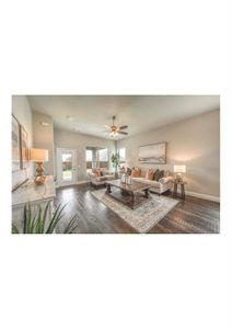 Living room featuring ceiling fan and hardwood / wood-style floors