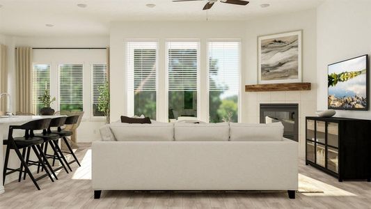 Living room with light hardwood / wood-style flooring, ceiling fan, and a tile fireplace