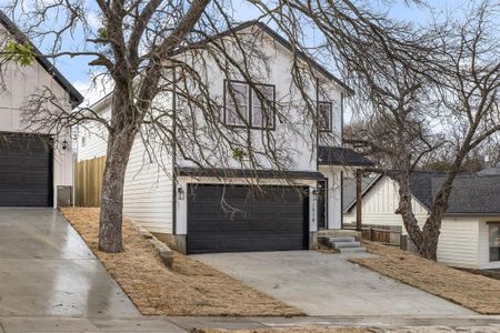 View of front facade featuring a garage