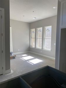 Spare room featuring a textured ceiling