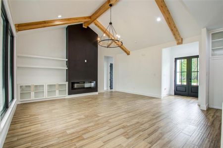 Spacious living with 16ft ceilings and oversized windows looking at your back patio (photos are from previous build, current home is about 55 days from completion)