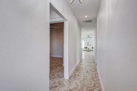 Corridor with light parquet flooring