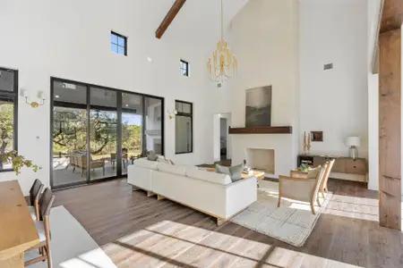 Beautiful main living area with tons of natural light. Looking towards covered back patio