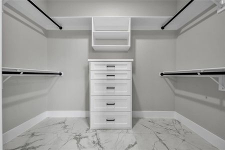 Walk in closet featuring light tile patterned flooring