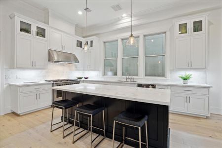 Island kitchen with quartz countertops & Fisher-Paykel appliances