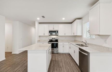 Airy kitchen with ample cabinet space *real home pictured