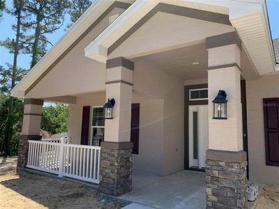 Actual Covered front porch, stone accents