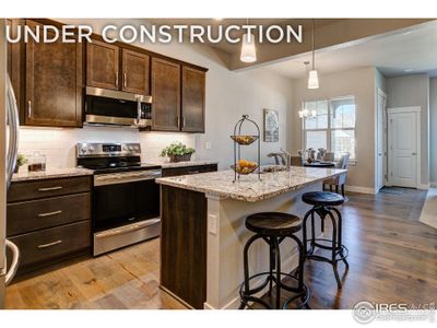 New construction Townhouse house 4112 Trapper Lake Dr, Loveland, CO 80538 - photo 0