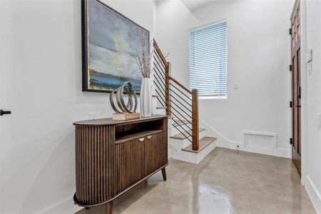 Just inside the front door, a staircase leads you to the second level of the home, offering easy access to additional living spaces.