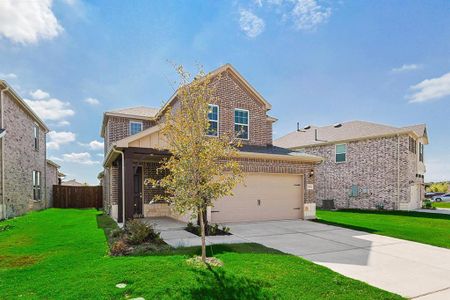 View of front of house with central AC unit, a garage, and a front lawn