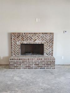 Room details with a brick fireplace