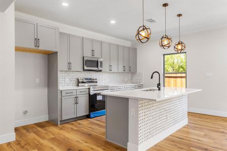 Bathroom with hardwood / wood-style floors, walk in shower, and toilet