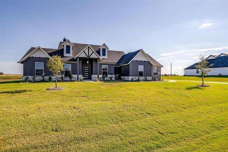 View of front of property with a front yard