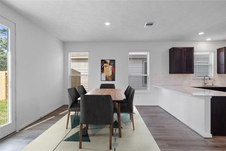 Make memories gathered around the table with your family and friends! This dining room features high ceilings, large windows with privacy blinds and recessed lighting!