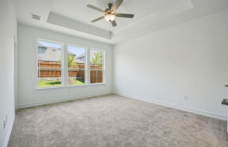 Owner's suite with oversized windows *real home pictured