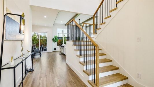 Stairway with hardwood / wood-style floors