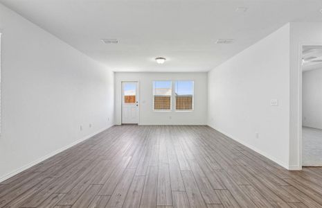 Airy gathering room with large windows *real home pictured