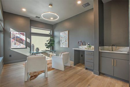 Bathroom with hardwood / wood-style flooring and vanity