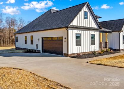 Two Car Garage with oversized 18 foot Garage Door. Double long parking driveway.