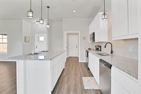 Chef's kitchen with oversized island, stainless appliances and lots of cabinets!