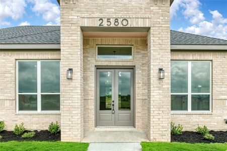 Property entrance featuring french doors