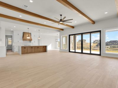 Exposed wood beams, tons of natural light and open floor plan