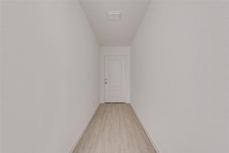 Hallway with light wood-type flooring