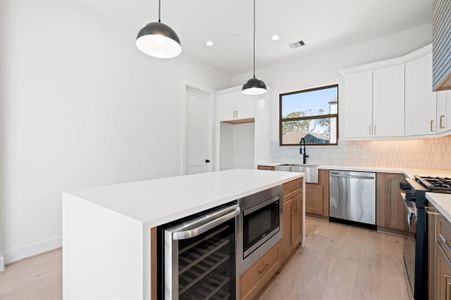 Here's a peak at the kitchen of another home by the same builder. Different layout. Similar finishes.